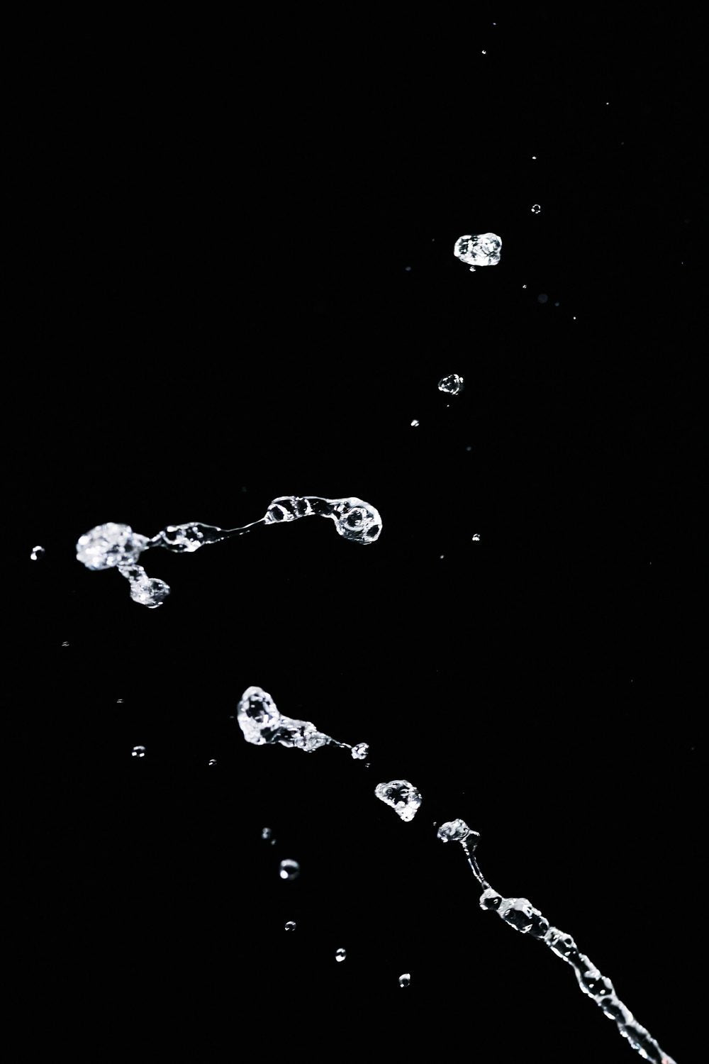 Clear water splash on black